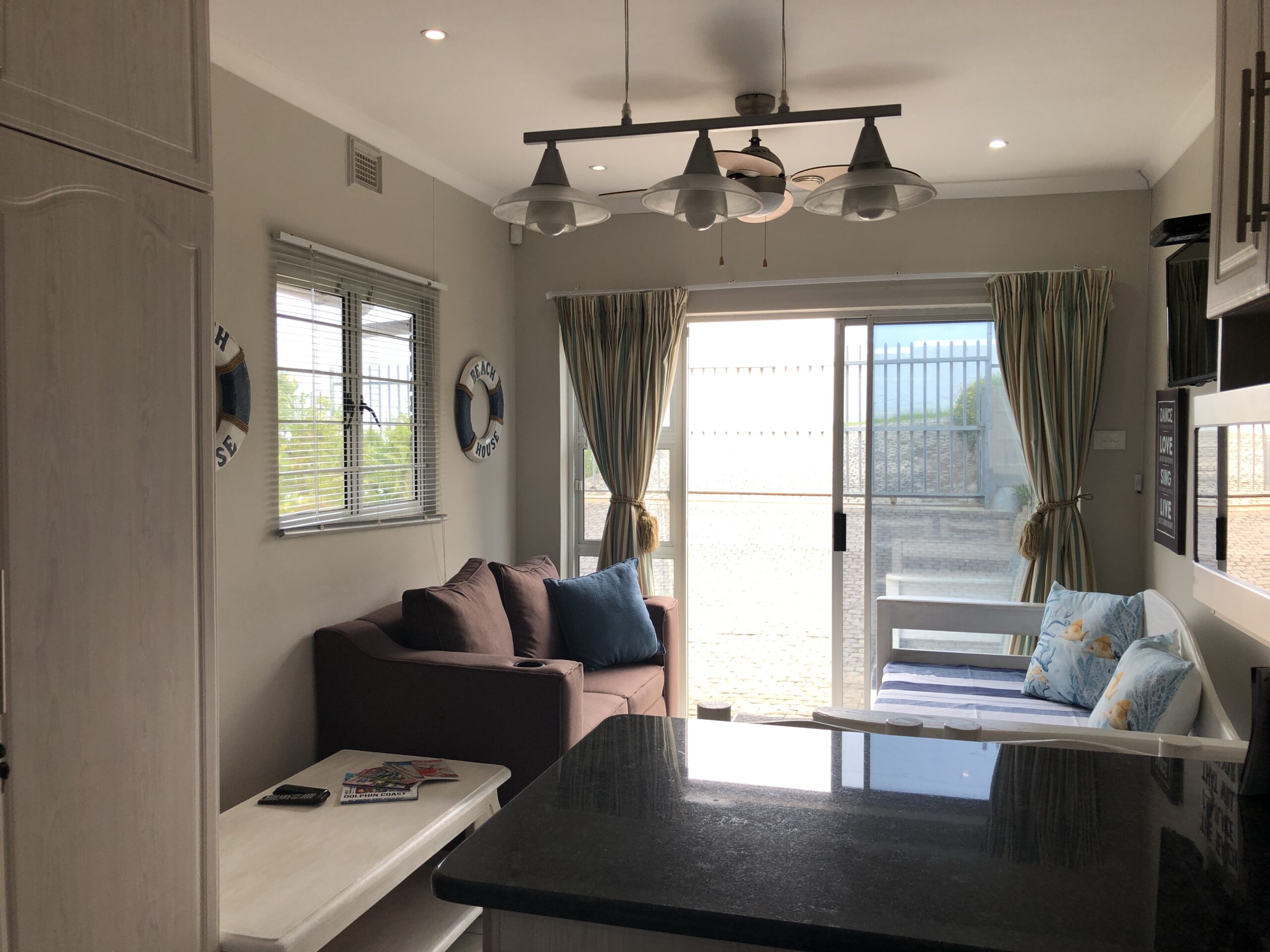Living area of the self-catering unit opening towards the courtyard